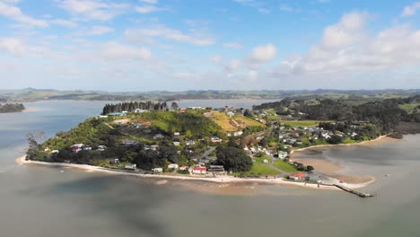 Drone-camera-circling-around-the-peninsula-of-Pahi,-New-Zealand