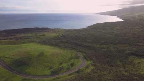 Aerial-footage-of-a-cmapervan-driving-along-the-open-coastline