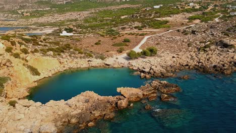 Aerial-footage-of-Voulolimni,-a-picturesque-natural-lake-like-Lagoon-is-one-of-the-finest-salt-water-natural-pools-in-Greece