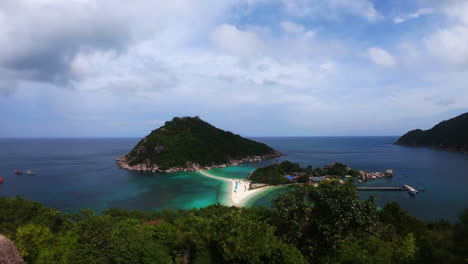 left-to-right-panning-shot-of-Koh-Nang-Yuan-Island-in-Thailand-Asia-showing-the-white-sand-double-beach-sandbar-and-the-clear-blue-waters-below-among-the-jungle-filmed-in-60fps-4K-downscaled-to-1080p