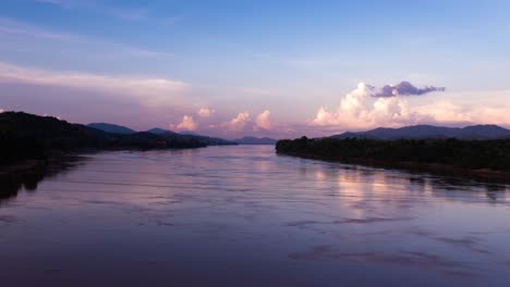 Evening-storm-clouds-bubbling-in-distance-with-flowing-River-mekong-in-foreground