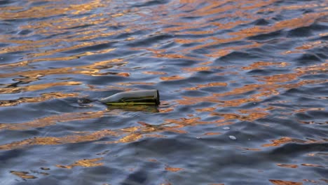 a-message-in-a-bottle-floats-in-a-sun-reflected-river