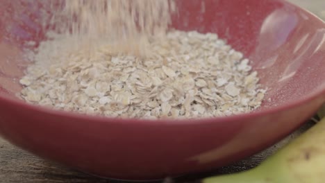 Pouring-oats-into-a-bowl