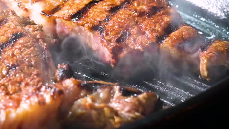 Grilled-hot-smoky-beef-steak-in-pan-for-delicious-dinner