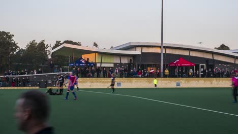 Timelapse-of-men's-premier-league-field-hockey-match-in-front-of-a-crowd-at-KBH-Brumbies-club-rooms-at-Elgar-Park