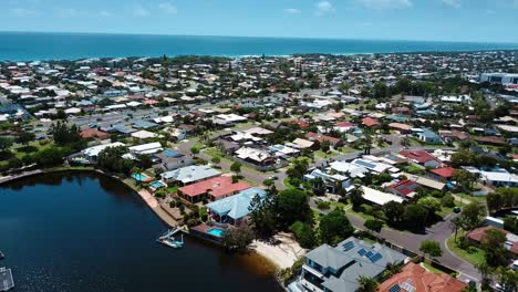 Flying-above-Gold-Coast-residential-area-and-shore