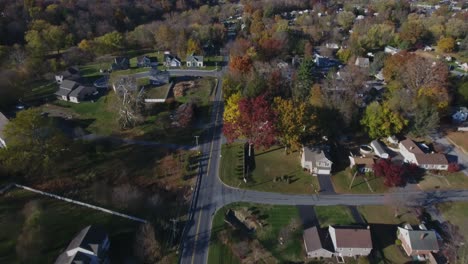 Aerial-view-traveling-north-along-Lampeter-Rd-in-West-Lampeter-Township,-Lancaster-County,-PA,-on-a-beautiful-fall-evening
