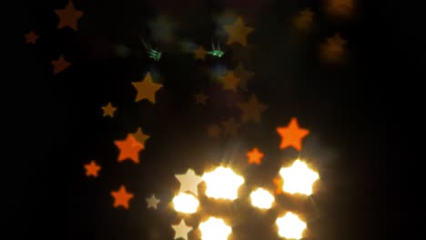 Beautiful-star-bokeh-from-moving-car-and-traffic-lights-at-the-evening,-Christmas,-winter,-holiday-or-glamour-party-background-concept,-copyspace