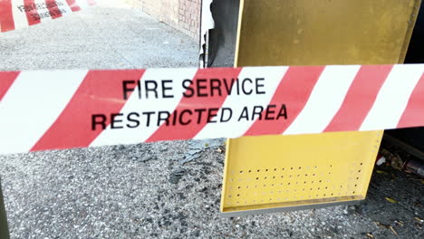 Fire-Service-Restricted-Area-tape-cordons-off-suspected-exploded-bin,-Brisbane-Australia