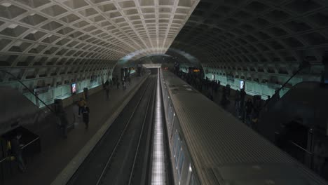 Washington-DC-metro-train-pulls-away-from-platform-and-commuters