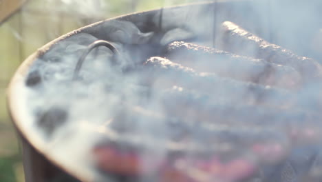 Slow-Motion-of-Charred-Gristly-Sausage-Grilling-on-Smokey-BBQ-Grill