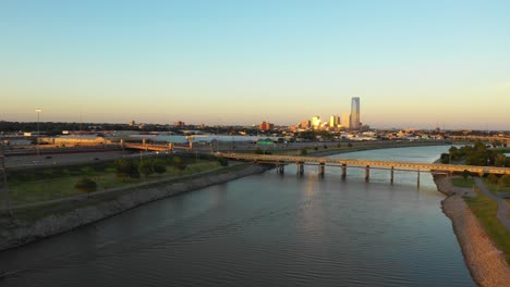 Oklahoma-City-Skyline-4K-Aerial-with-Bridge-and-Sunset