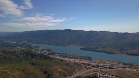 Aerial-of-mountains-and-lake-of-crystal-springs-reservoir-in-san-mateo,-california-slow-move-forward
