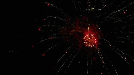 Slow-Motion-Aerial-of-Fireworks-Over-Small-Town