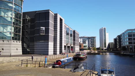 Left-to-Right-Pan-of-Leeds-Dock-Mixed-Development-in-Yorkshire,-UK-on-a-Sunny-Summer’s-Day-with-Blue-Sky