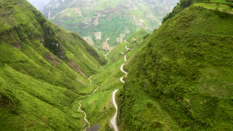 Gorgeous-mountain-road-carved-into-a-steep-valley