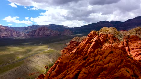 Aerial-Drone-shot-flying-up-above-the-Red-Rock-Canyon-Mountains-during-the-daytime-in-Las-Vegas-Nevada