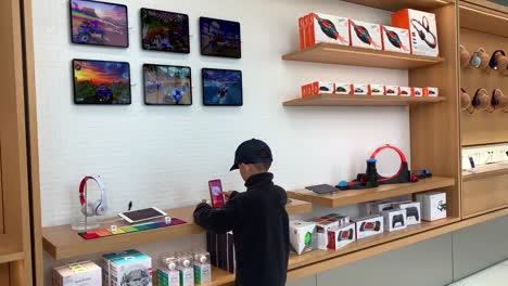 Boy-testing-out-new-products-at-the-Apple-Store