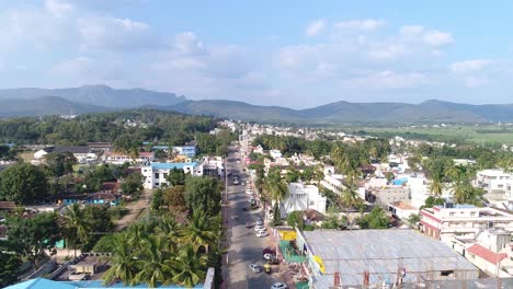 Aerial-flying-over-Chikmagalur-downtown-street-on-sunny-day