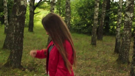 Girl-walking-through-the-trees