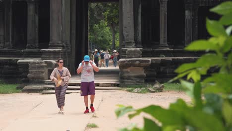 Tourists-Walking-Through-the-Angkor-Wat-Entrance