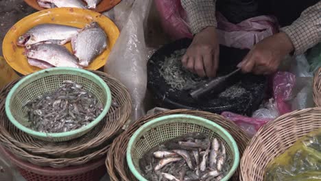 Separating-Shrimp-With-Knife-on-Chopping-Board-at-the-Fish-Market
