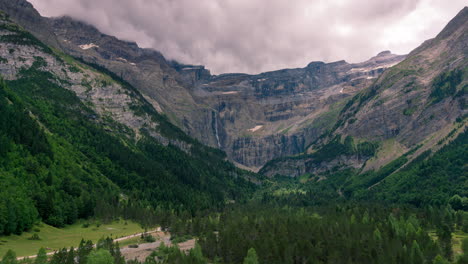 Timelapse-of-sunset-in-Gavarnie-Valley,-The-little-town-of-Gavarnie-as-foreground-and-the-big-waterfall-as-background