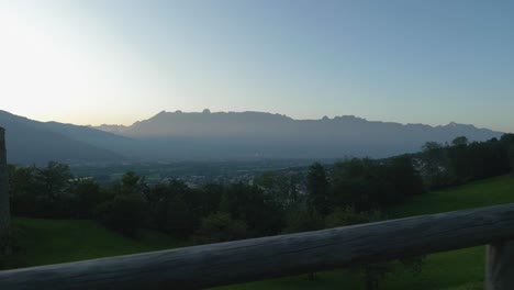 Sunset-over-mountains-in-Vaduz,-Liechtenstein,-gimbal-slide-right