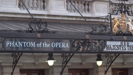Phantom-of-the-Opera-sign-at-Her-Majesty's-Theatre,-close-up-panning-shot