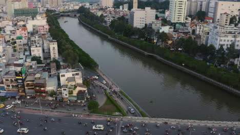 High-panning-aerial-view-of-Dien-Bien-Phu-Bridge,-Binh-Thanh-district,-Ho-Chi-Minh-City,-which-crosses-the-Hoang-Sa-canal