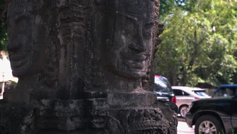 Slider-Shot-of-Khmer-Face-Carving-with-Cars-in-the-Background