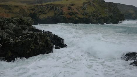 Waves-Crashing-On-Coastline-Rocks-In-Slow-Motion-At-Calf-Of-Man,-Isle-Of-Man