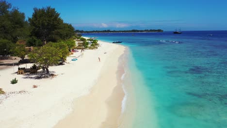 Paradise-white-sand-beach-on-the-tropical-island,-tourists-enjoying-a-summer-holiday
