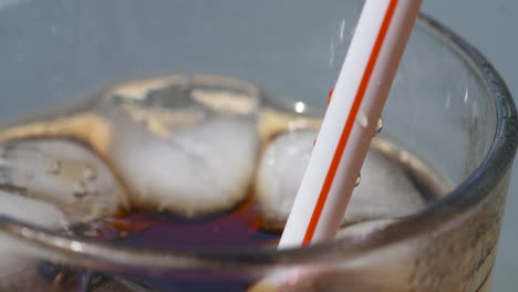 Close-up-macro,-refreshing-drink-is-sipped-through-a-straw