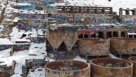 A-drone-shot-of-the-Old-Tintic-Mill-in-Genola,-Utah,-captures-the-water-and-leaching-tanks-as-well-as-the-roasters,-built-in-the-1920s