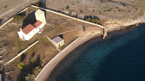 Island-Zecevo-near-Zadar,-Croatia-and-christian-church-from-the-Adriatic-sea
