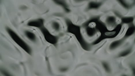 Extreme-macro-shot-of-water-forming-different-waves-and-ripples