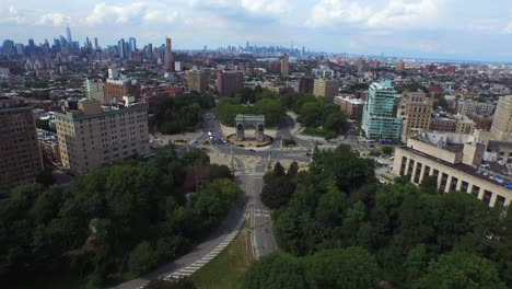Gorgeous-aerial-view-of-Grand-Army-Plaza-flying-back-over-Prospect-Park-with-NYC-Skyline-4K