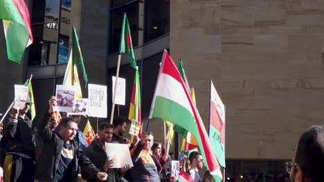 Slow-motion,-close-up-of-people-protesting-against-the-Turkish-occupation-and-ethnic-cleansing-of-the-Kurds-in-Glasgow