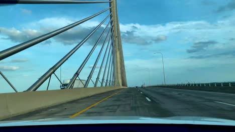 View-of-Toledo-Cityscape---Veterans-glass-city-Skyway-Bridge-from-a-driving-car-on-the-road-of-Detroit-toledo-expressway