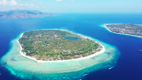 beautiful-islands-in-the-tropical-ocean,-an-aerial-panorama-of-the-atolls-near-the-coast-of-the-Lombok,-Gili,-Indonesia