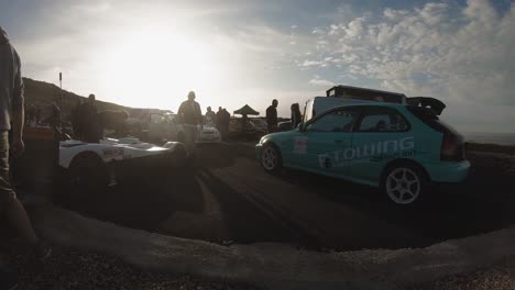 Men-Looking-At-The-Customized-Sports-Cars-Parked-At-The-Roadside-On-The-Hill-In-Imtahleb-Malta---GoPro-Pan-Shot