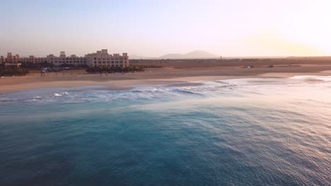 Drone-footage-of-waves-crashing-onto-a-beach,-Cape-Verde