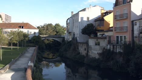 Leiria,-Portugal---Houses,-And-Buildings-In-Between-The-Lis-River-On-A-Sunny-Day---Medium-Shot