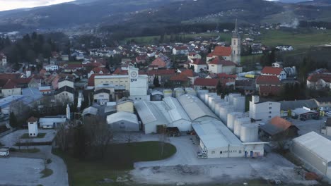 Industrial-area-in-small-town-in-Europe,-factory-in-urban-area-of-Slovenska-Bistrica,-Gea-Oil-Factory,-aerial-view-of-oil-mill-and-food-industry