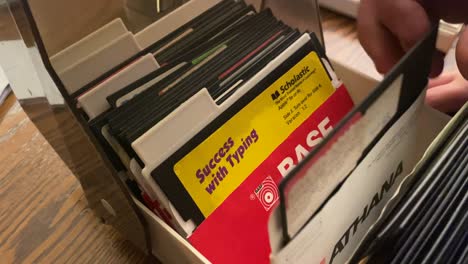 Apple-software-programs,-games,-diskettes-in-a-storage-box,-five-and-a-quarter-inch-floppy-discs
