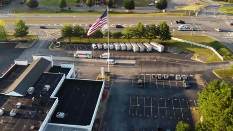A-selection-of-Uhaul-moving-vehicles-parked-on-a-lot-at-a-Uhaul-store-in-Woodstock-Georgia