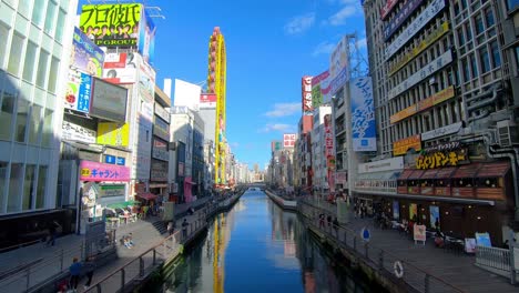 Panorama-view-of-iconic-streets-along-Dotonbori-canal-in-Osaka,-Japan