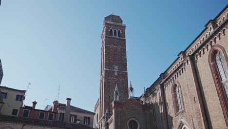 East-front-of-the-Basilica-di-Frari-with-Romanesque-terracotta-bell-tower,-Venice,-Italy