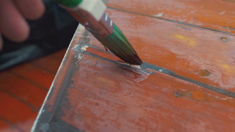 Painting-wooden-slip-repair-to-boat-wheelhouse-roof-planking